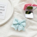 Detail of cute 3D bow phone socket with integrated mirror in blue and pink finish - Blue