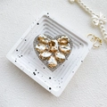 Detail of luxury heart phone grip featuring champagne rhinestones and sparkling crystals - Gold