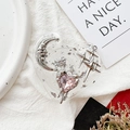 Close-up of heart phone grip with silver moon and pink crystal on white linen - Moon Meteor No.8