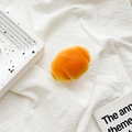 Detail shot of realistic croissant phone grip on white linen fabric background - Transparent Bracket - Round Croissant