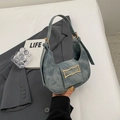 Fashionable blue denim half-moon saddle bag with a golden metal buckle and adjustable strap - Denim / Blue