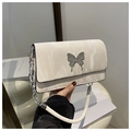 Detail of marble pattern white leather bag with silver butterfly clasp and chain strap - White
