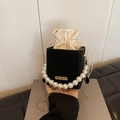 Black suede bucket bag with decorative pearl handle and gold chain strap - Black