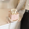 Pink pleated bucket bag with pearl handle, drawstring closure and gold chain strap - Pink