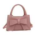 Sweet pink handbag with a large bow detail and adjustable shoulder strap for women - Pink