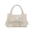 White fashion handbag featuring a large 3D bow design and detachable shoulder strap - White