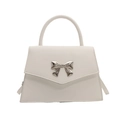 White faux leather bow handbag with trapezoidal structure and silver butterfly detail - White