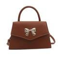 Brown crossbody bag with silver bow buckle and adjustable strap for women - Brown