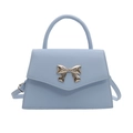 Light blue trapezoid handbag with silver metal bow and detachable shoulder strap - Blue