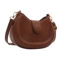 Minimalist brown half-moon shoulder bag with circular magnetic buckle on white background - Brown