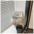 Detail of silver butterfly ornament and metal chain on light gray textured mini backpack - Silver