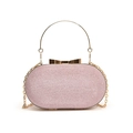 Bolso de noche rosa con lentejuelas, asa redonda dorada y elegante cierre de lazo - Rosa