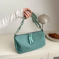 Minimalist mint green canvas crossbody bag with decorative plastic chain strap detail - Green