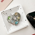 Macro detail of heart-shaped phone grip with colorful rhinestones and silver plating - Electroplated Heart Stand - Mixed Color Gem Butterfly