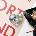 Macro view of heart-shaped silver phone grip with inlaid pink rhinestones and a gold butterfly - Electroplated Heart Stand - Light Purple Gem Butterfly