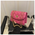 Close-up of pink quilted crossbody bag featuring a golden geometric turn-lock buckle - Rose Pink