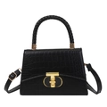 Elegant black crocodile pattern handbag with gold T-lock and woven handle on white background - Black