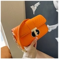 Quilted bright orange shoulder bag with golden chain and metallic twist lock closure - Orange