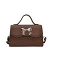 Mini crossbody square bag in dark brown Saffiano leather with gold bow clasp feature - Brown
