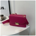 Detail of fuchsia square bag with gold metal buckle and wide leather shoulder strap - Rose Pink