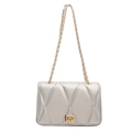 Quilted silver crossbody chain bag with metallic finish and gold twist lock clasp - Silver