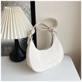Detail of white hobo bag with pleated texture, gold hardware, and adjustable shoulder strap - Off White