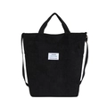 Bolso tote grande de pana negra con asas dobles y etiqueta de moda en fondo blanco - Negro