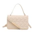 Chic beige quilted handbag with gold hardware and top handle shown in frontal view - White