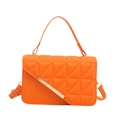 Chic orange quilted crossbody bag with golden metal trim and top handle for women - Orange