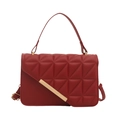 Modern red quilted handbag with gold metal bar accent and adjustable crossbody strap - Red