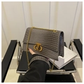 Detail of grey crocodile pattern chain bag with golden twist lock and PU texture - Gray