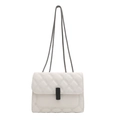 Classic white quilted flap bag with chain strap and black rectangular turn-lock closure - White