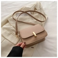 Detail of beige faux leather crossbody bag with a polished gold rectangular metal buckle - Khaki
