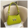 Detail of neon green crossbody bag with silver bow accent and knotted handle strap - Green