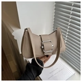 Close-up of beige PU leather shoulder bag featuring a prominent silver buckle accent - Khaki