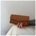 Handheld view of a brown quilted long wallet with a classic diamond lattice pattern - Tan