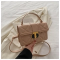 Close-up of quilted nude PU leather bag featuring a gold metal buckle and top handle - Khaki