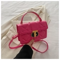Detailed view of quilted magenta PU leather crossbody bag with gold metal lock closure - Rose Red