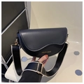 Chic black saddle bag in PU leather featuring a wide black and white woven shoulder strap - Black