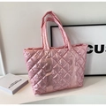 Detail of pink quilted puffer tote bag with metallic sheen and diamond lattice pattern - Pink