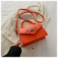 Bright orange mini handbag with rhinestone bow detail and adjustable shoulder strap - Orange