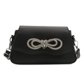 Elegant black shoulder bag with a large sparkling rhinestone bow on matte leather - Black