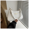 Detail of white PU leather underarm bag featuring twisted rope handle and gold accents - White