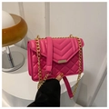 Close-up of fuchsia quilted PU leather shoulder bag with gold chain and metal lock - Rose Red