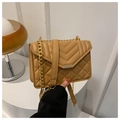 Detail view of khaki quilted crossbody bag with gold rectangular clasp and metal chain strap - Khaki