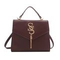 Minimalist burgundy square shoulder bag with gold SS logo and elegant tassel detail - Burgundy