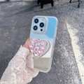 Macro detail of a sparkling pink rhinestone heart socket on a clear mirror iPhone case - Pink (Electroplated Mirror + Large Rhinestone Heart Stand) / iPhone 7/8/SE 2020