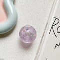 Macro shot of purple glitter star donut phone grip on white textured surface - Purple (Contrasting Stars)
