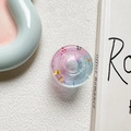 Close-up of a star-shaped glitter phone grip with pink and blue gradient resin - Pink Blue (Contrasting Stars)
