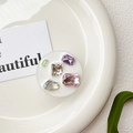 Detailed macro view of white cell phone socket with inlaid colorful crystal gemstones - Drip Glue Stand - White Base Colorful Rhinestones - Round